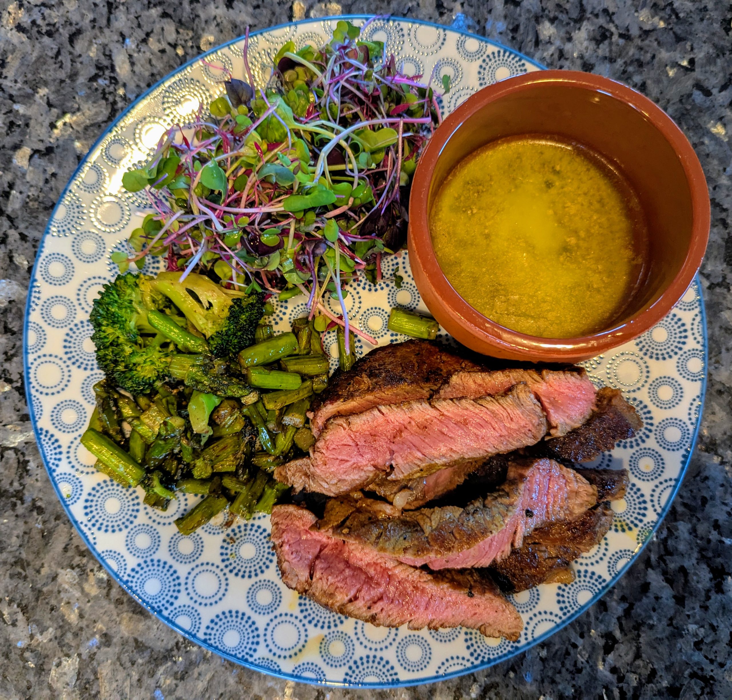 Brassica microgreens with steak, greens, and garlic butter